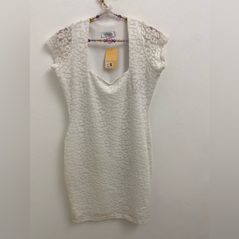 white lace mini dress with square neck and short sleeves
